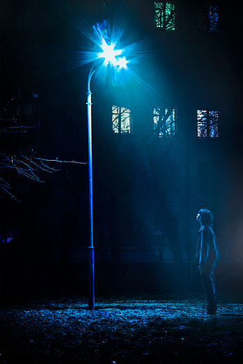 Man Standing in Front of Street Light Turned on · Stock, streetlight HD phone wallpaper